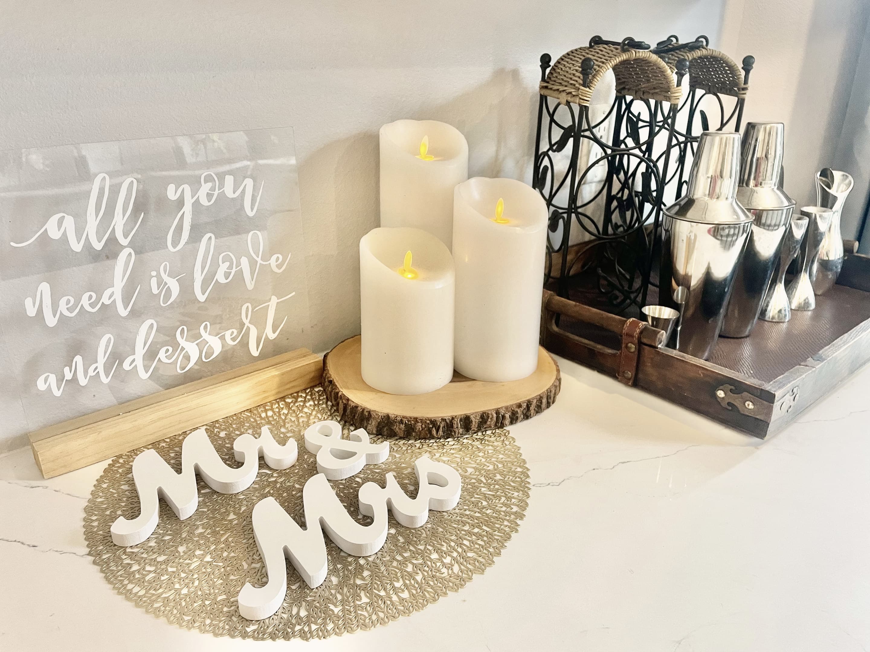 Candles, a 'Mr & Mrs' sign and serving pieces from the venue's decor