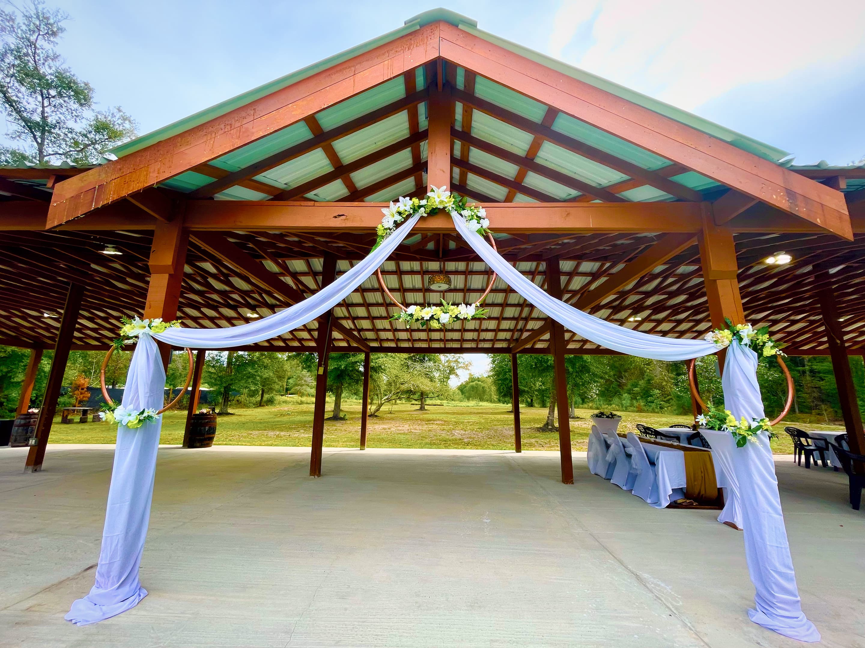 Ivory fabric swags hung through the pavilion's timber trusses